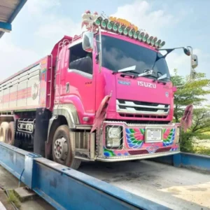 A Bisonte weighing system in operation, capturing data on passing vehicles in Thailand.